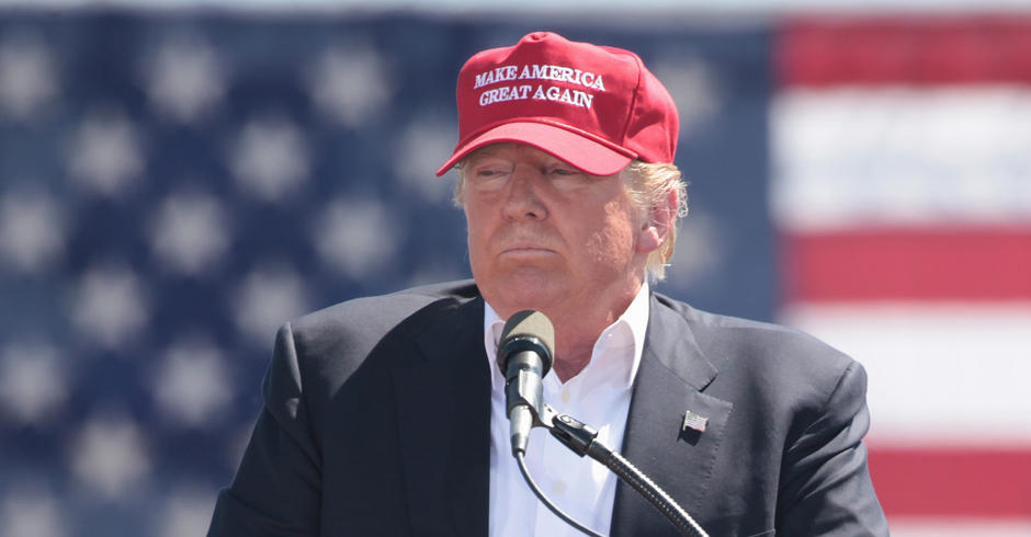 Donald Trump wearing a MAGA baseball cap during rally
