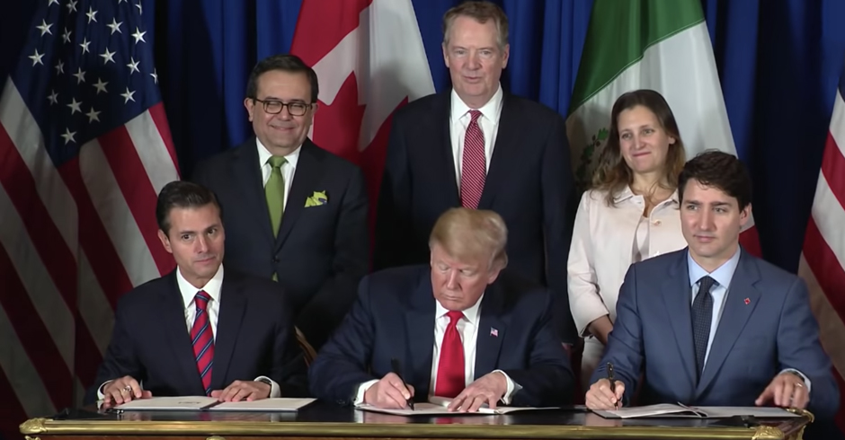 The three leaders signing the USMCA