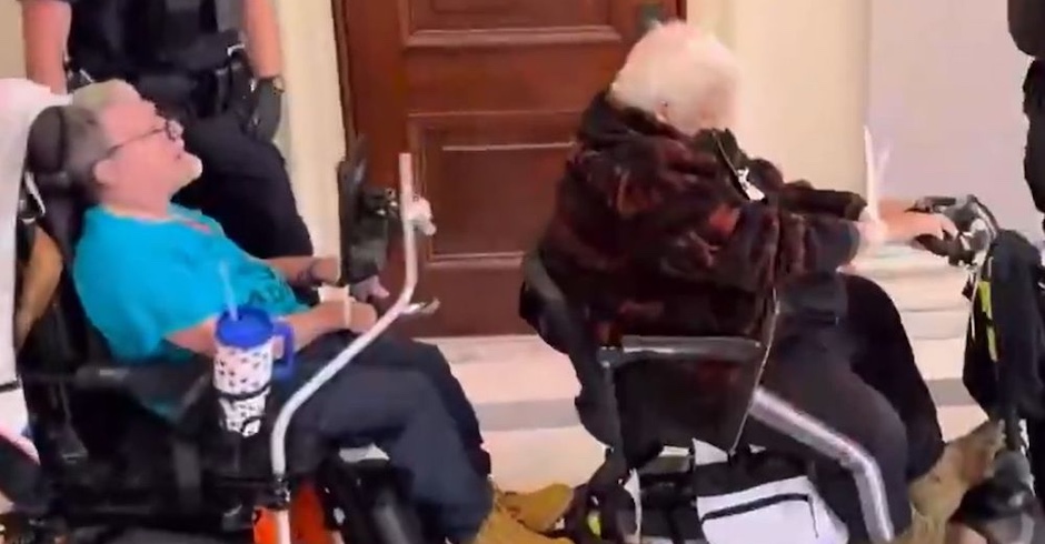 disabled protesters with zip ties around wrists